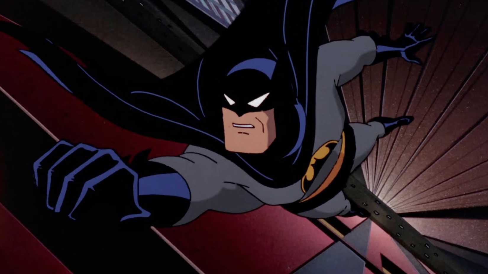 Batman hangs from a roof in Batman the animated series