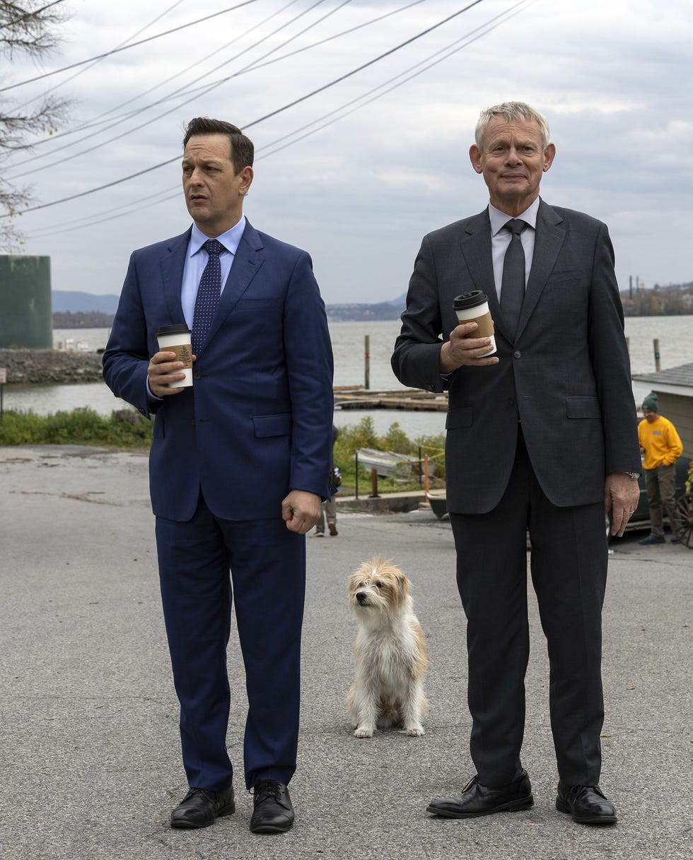 josh charles and martin clunes holding coffee cups in the doc martin episode special in best medicine