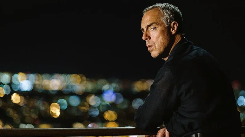 Harry Bosch (Titus Welliver) looks back while on a balcony overlooking Los Angeles in Bosch