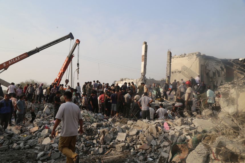 People and rescue forces work following an Israel strike on a school in Minab, Iran, February 28, 2026.