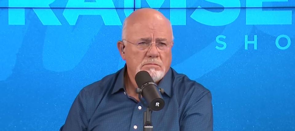 Dave Ramsey frowns in thought as he listens to a caller's woes.