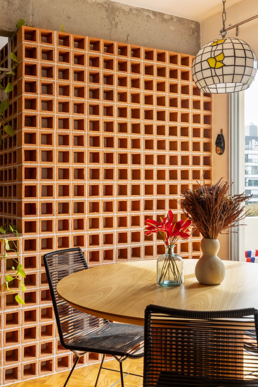 Perforated blocks that are straight-stacked to create a grid pattern 