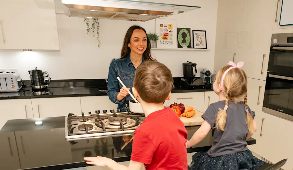 Nichola Ludlam-Raine cooking with her children.