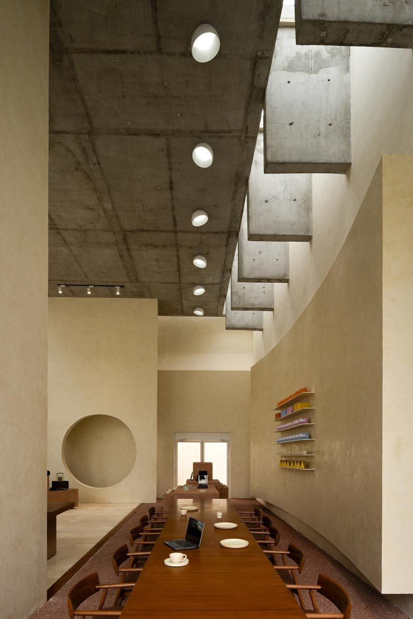 sand-hued geometric volumes of chennai café interior draw on their coastal context - 3