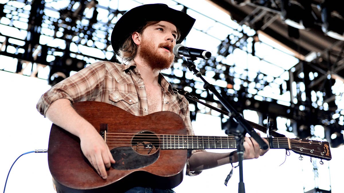Colter Wall performs onstage with a guitar during the 2018 Stagecoach Country Music Festival at the Empire Polo Field in Indio, California.