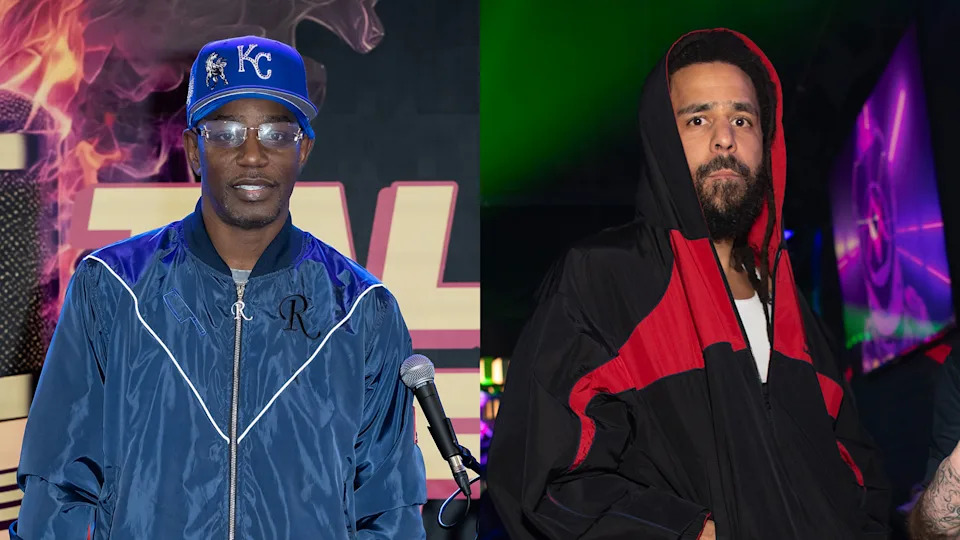 Two men are pictured: Cam'ron in a blue jacket and KC cap, and J. Cole in a black and red hooded outfit, both in front of colorful backdrops.