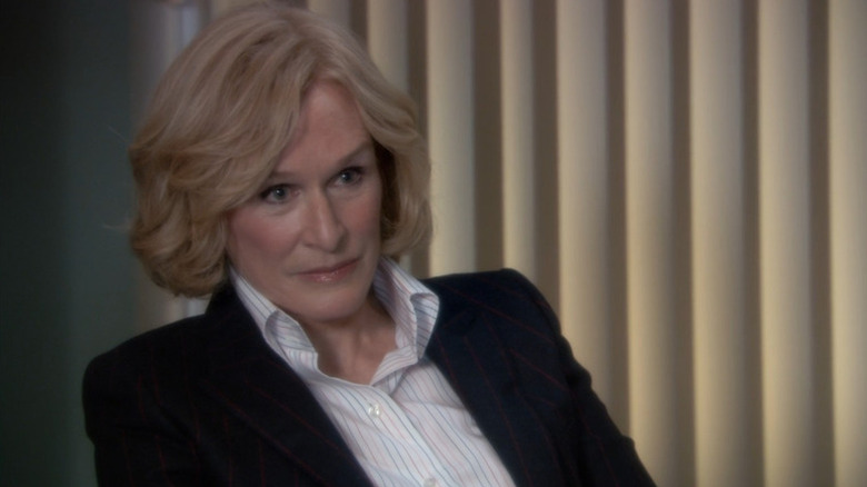 Patty Hewes (Glenn Close) reclines while seated in her office in Damages