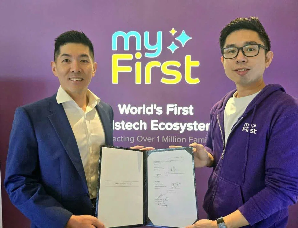 Fu Yu group chief executive and executive director David Seow (left) and myFirst co-founder and chief executive G-Jay Yong.