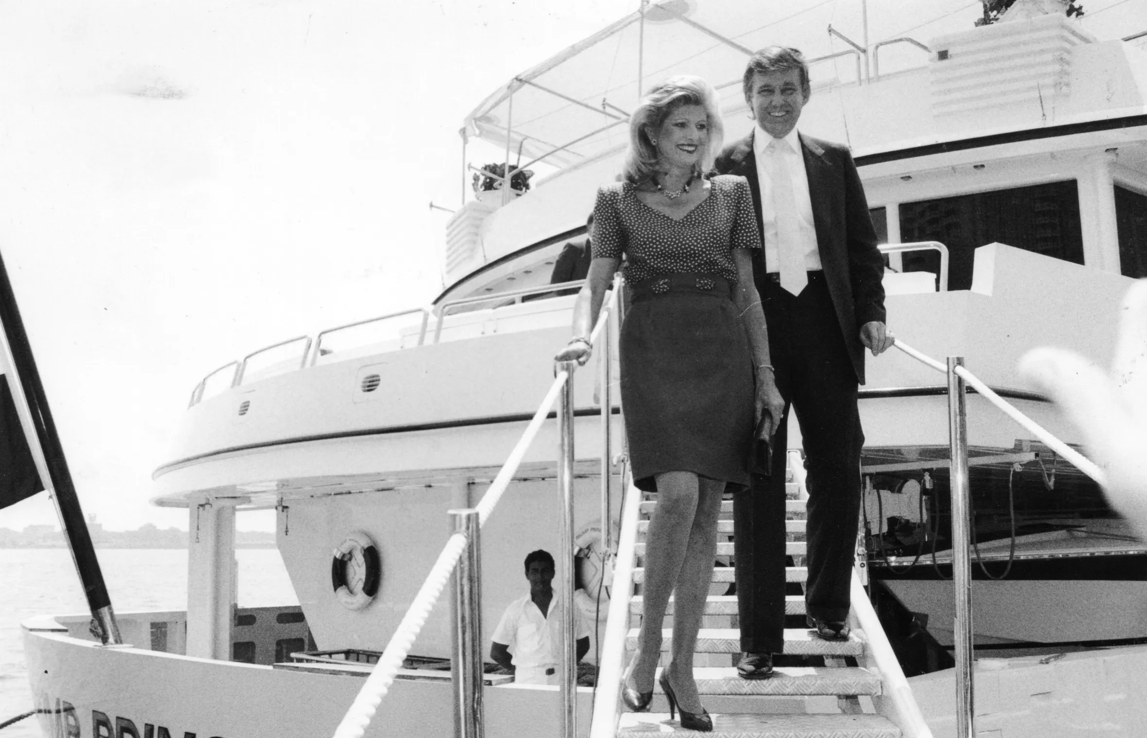 Donald and Ivana Trump descending stairs on the Trump Princess yacht.