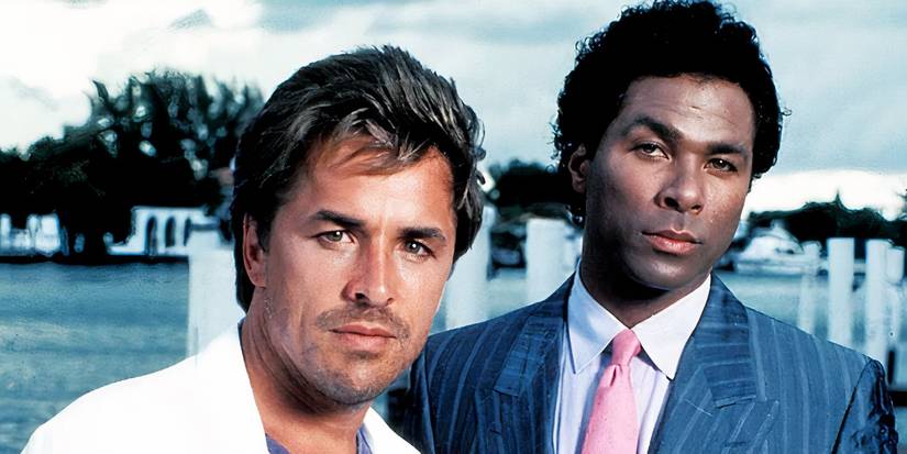 Detective Sonny Crockett (Don Johnson) and Detective Rico Tubbs (Philip Michael Thomas) looking forward in Miami Vice