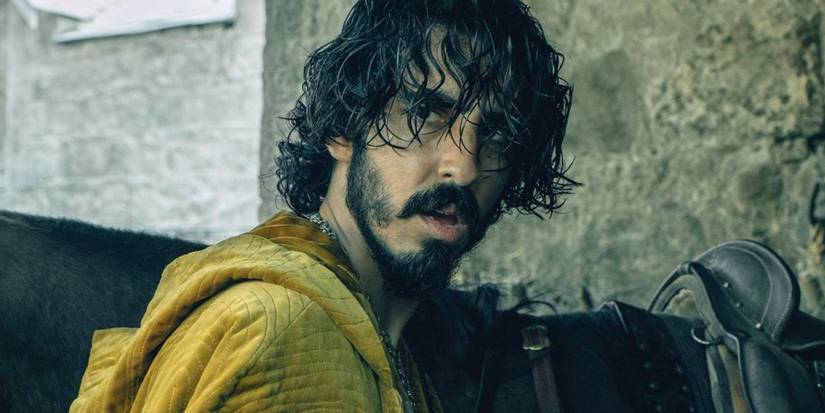 Dev Patel looking over his shoulder in The Green Knight