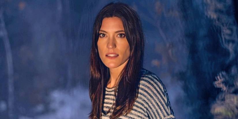 Debra from Dexter standing outside, looking worried.