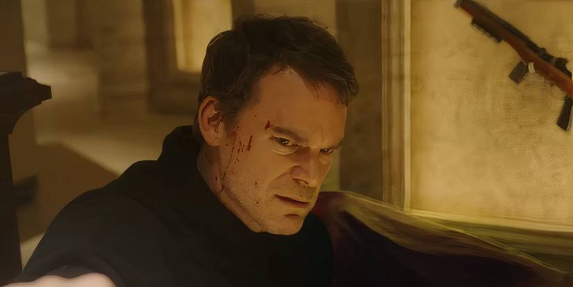 Dexter Morgan (Michael C. Hall) with a bloody face looking angry on Dexter: Resurrection.
