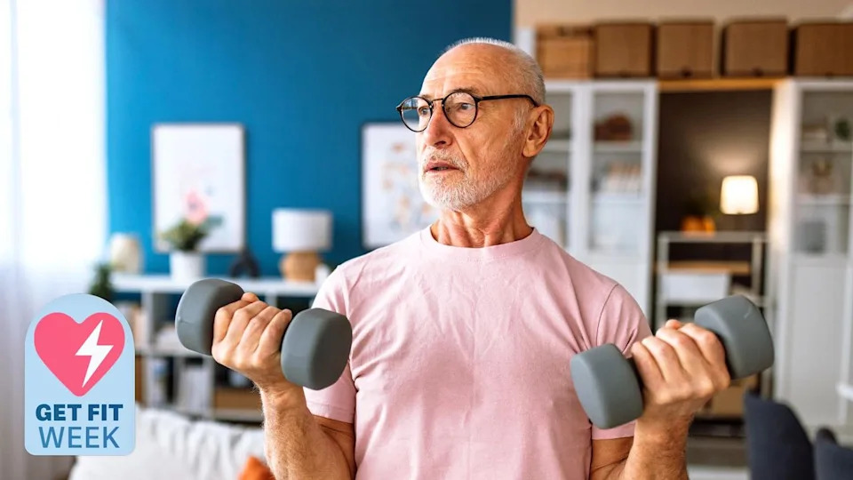 A senior man holding two dumbbells.
