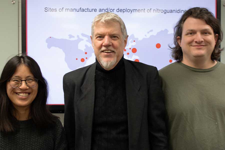 a female student with black hair on the left, an elder male with grey hair in the middle, and a white male young student on the right