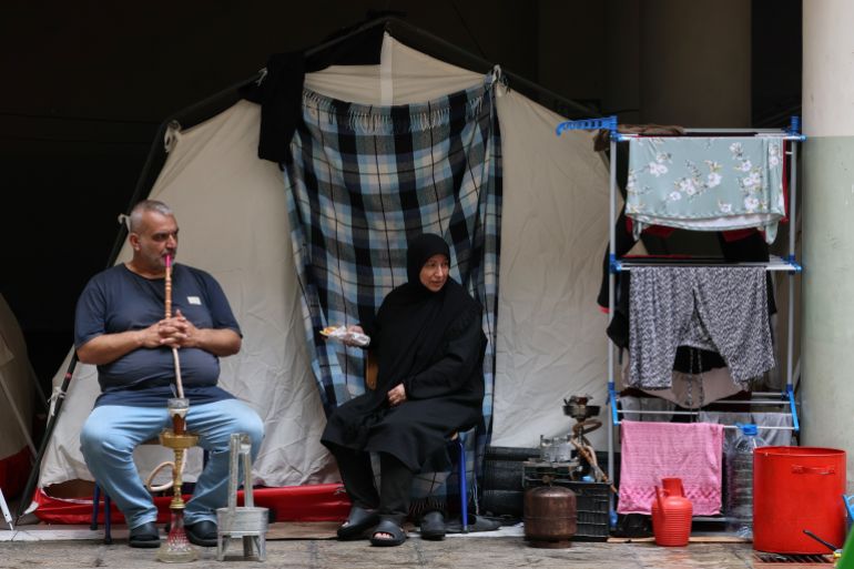 epa12853726 Displaced residents sit outside a tent in a local school after fleeing their homes in southern Lebanon following Israeli airstrikes, in Beirut, Lebanon, 27 March 2026. According to the Disaster Management Unit of the Lebanese government, as of 27 March 2026, more than 1,785,000 people have been internally displaced in collective shelters in Lebanon since the escalation began on 02 March. EPA/WAEL HAMZEH