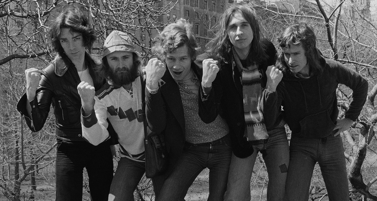 English progressive rock group Genesis in Central Park, New York City, 20th April 1976. Left to right: guitarist Steve Hackett, singer Phil Collins, drummer Bill Bruford, bassist Mike Rutherford and keyboard player Tony Banks. (Photo by Michael Putland/Getty Images)