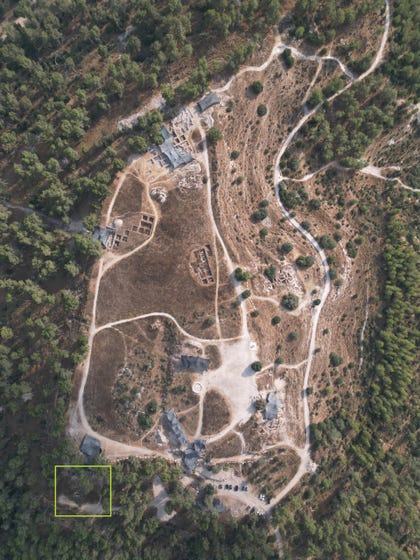 Aerial view of Tel Azekah and the location of the mass grave in the square at the lower left