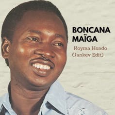 An album cover showing a young, smiling African man with a moustache.