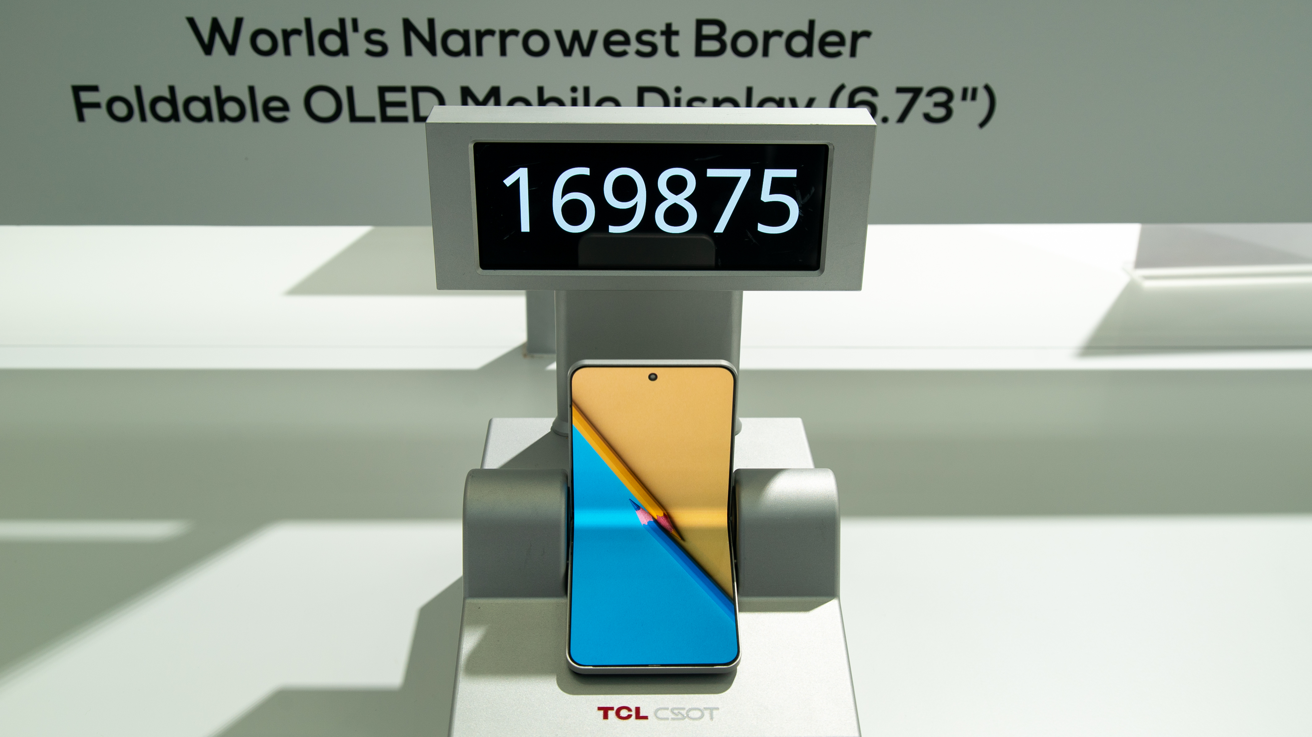 A foldable phone with a minimal bezel performing a folding test