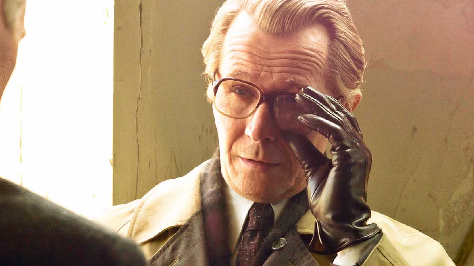Gary Oldman tugs his glasses in a tense scene from Tinker Tailor Soldier Spy