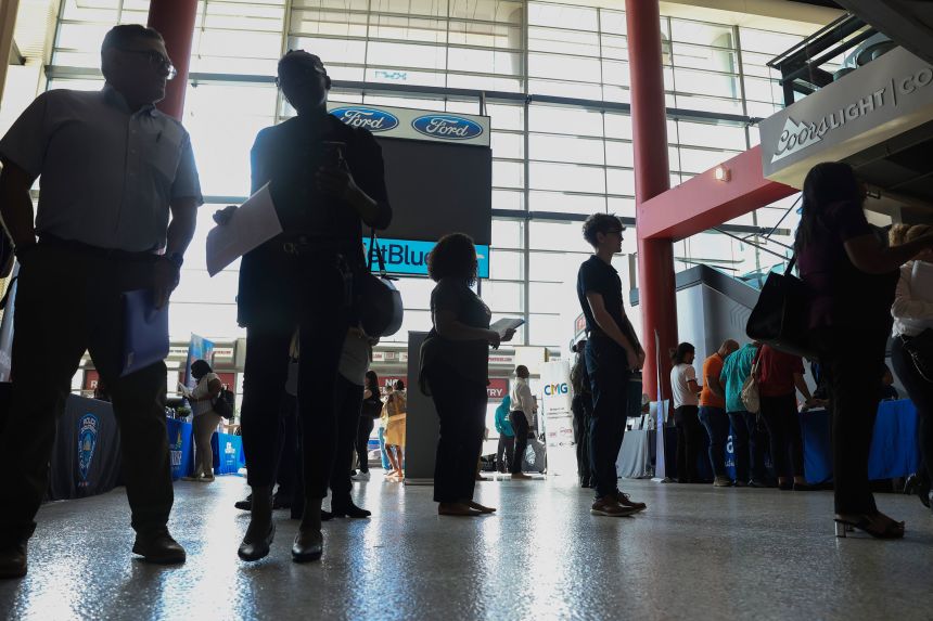 Job seekers attend a job fair held in the Amerant Bank Arena in Sunrise, Florida, on September 25, 2025.