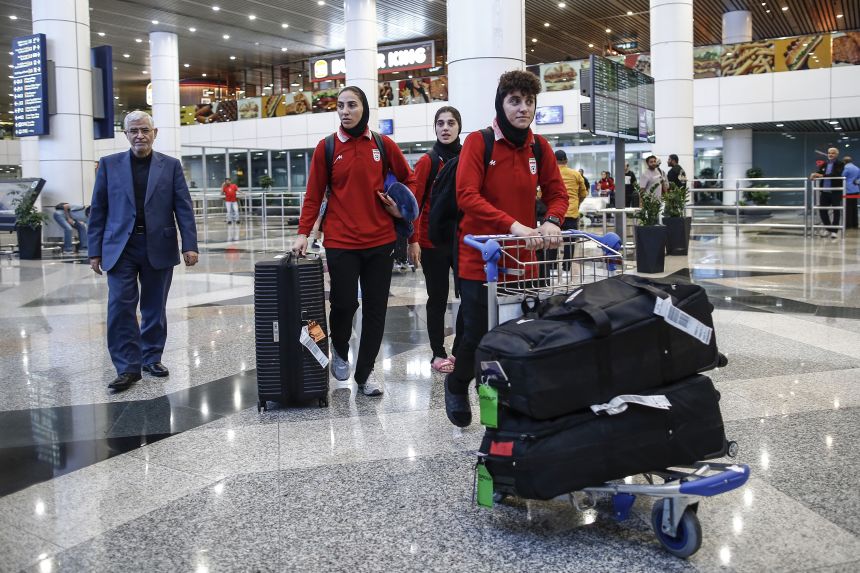 Members of Iran's women's football team arrive at the Kuala Lumpur International Airport