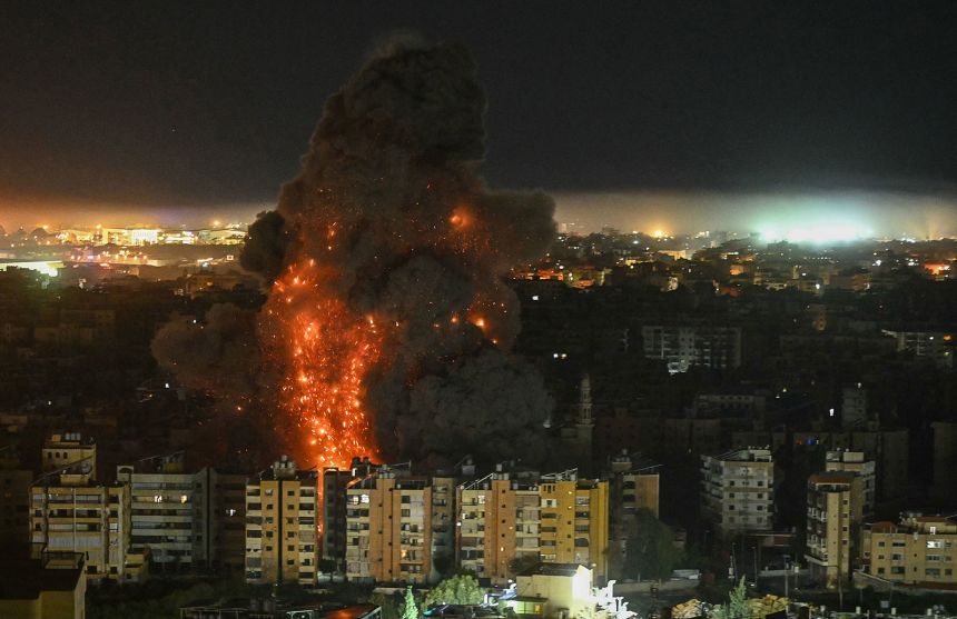A fireball rises from the site of an Israeli airstrike that targeted an area in Beirut's southern suburbs overnight from March 10 to 11, 2026.