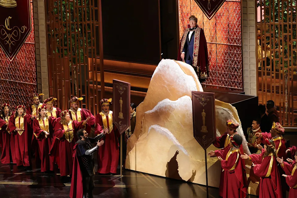 Josh Groban and host Conan O'Brien perform onstage during the 98th Oscars.