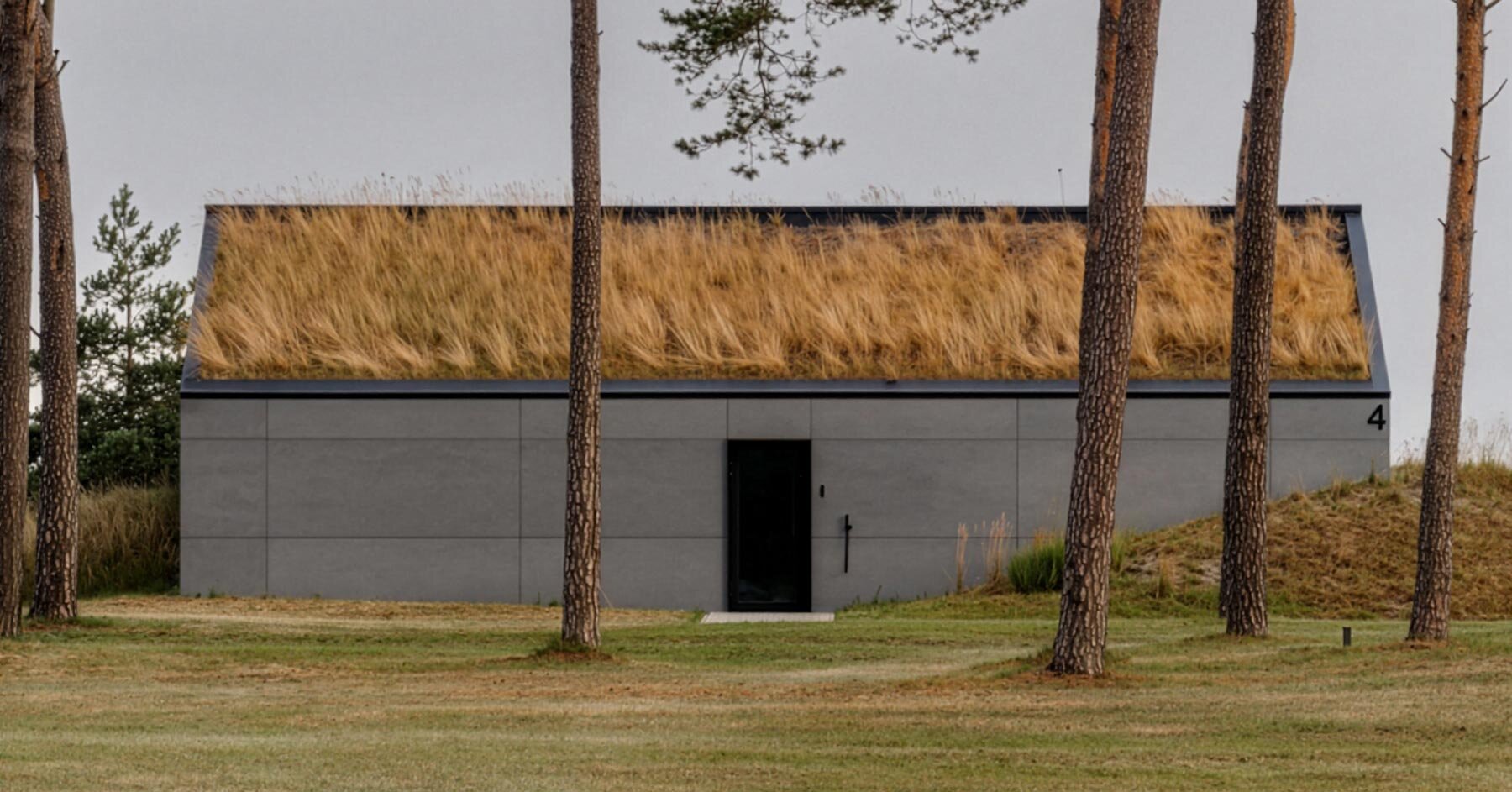 seaside home repurposes abandoned military bunkers in latvia