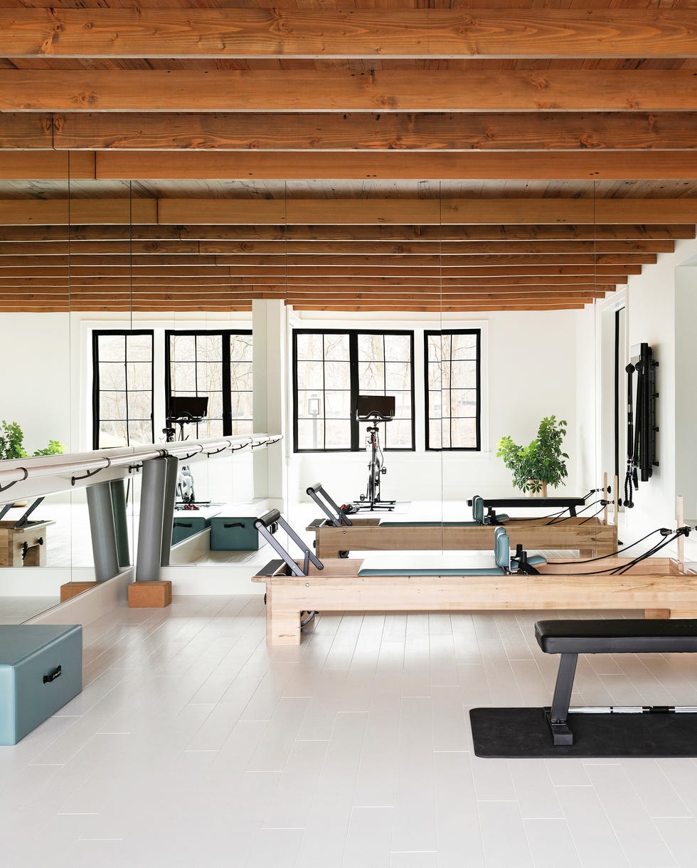 lower level gym. mirrors installed floor to ceiling across two walls make this room by lauren buxbaum gordon of nate berkus associates seem double the size—and brighter. peterssen keller architecture + hnh homes + nate berkus associates 5200 dundee rd, edina, mn 55436