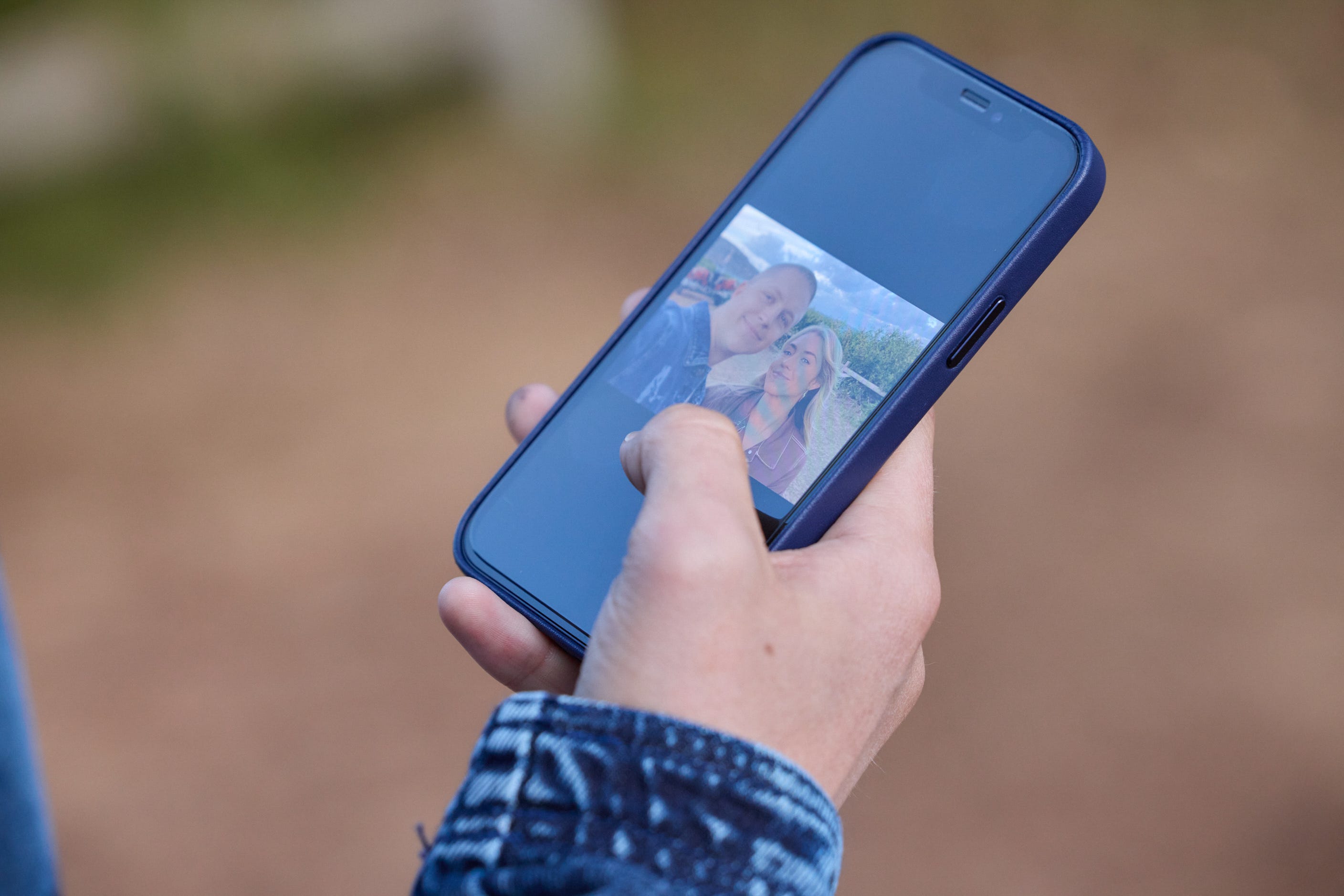 holden dwyer looks at his phone in home and away