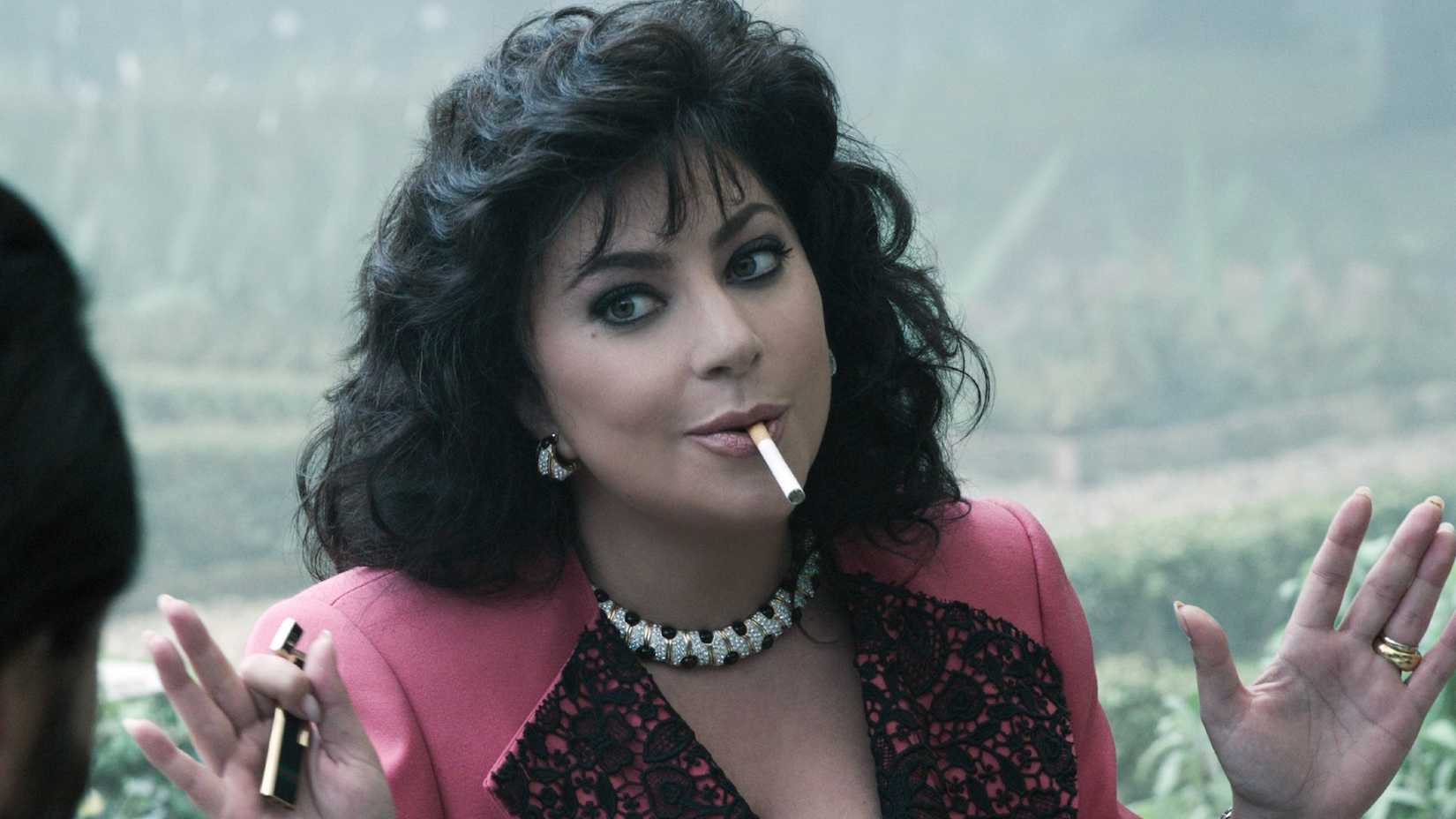 Lady Gaga holds up her hands in House of Gucci