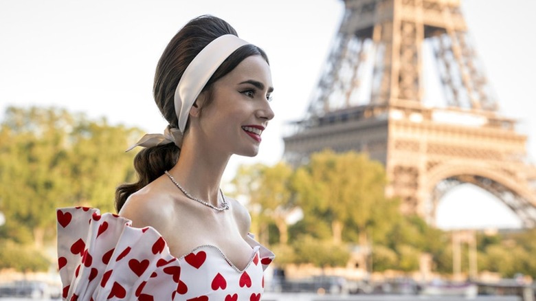 Emily wearing a heart dress with the Eiffel Tower in the background in 