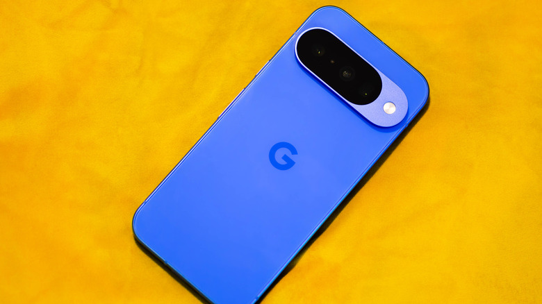 A close-up of the Google Pixel 10 smartphone in Indigo Blue color