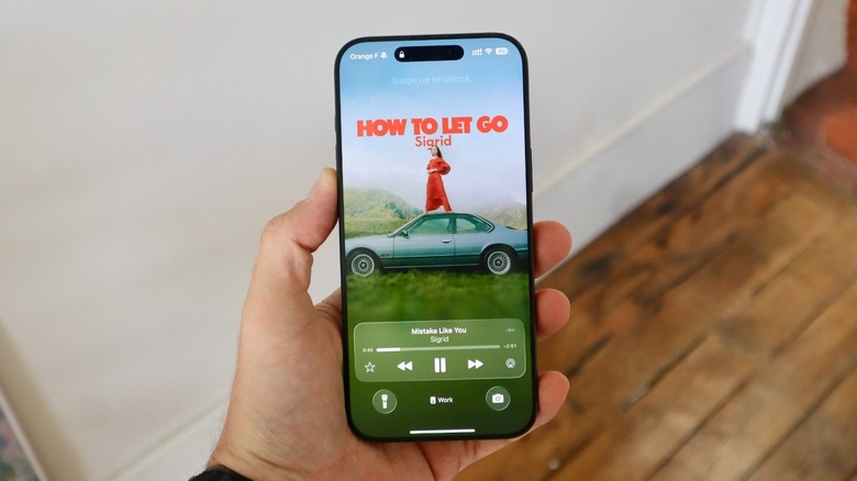 A hand holding an iPhone 16 Pro Max