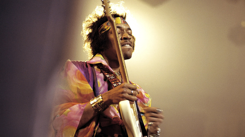 Jimi Hendrix plays guitar with eyes closed in 1969