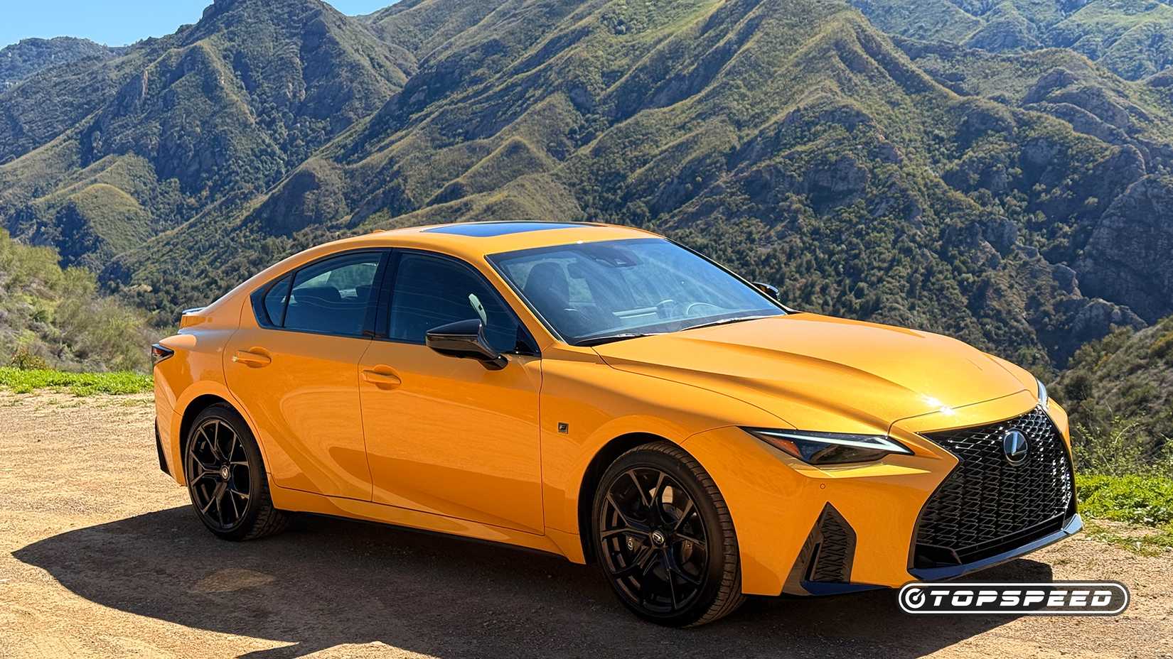 2025 Lexus IS 500 in yellow parked off-road