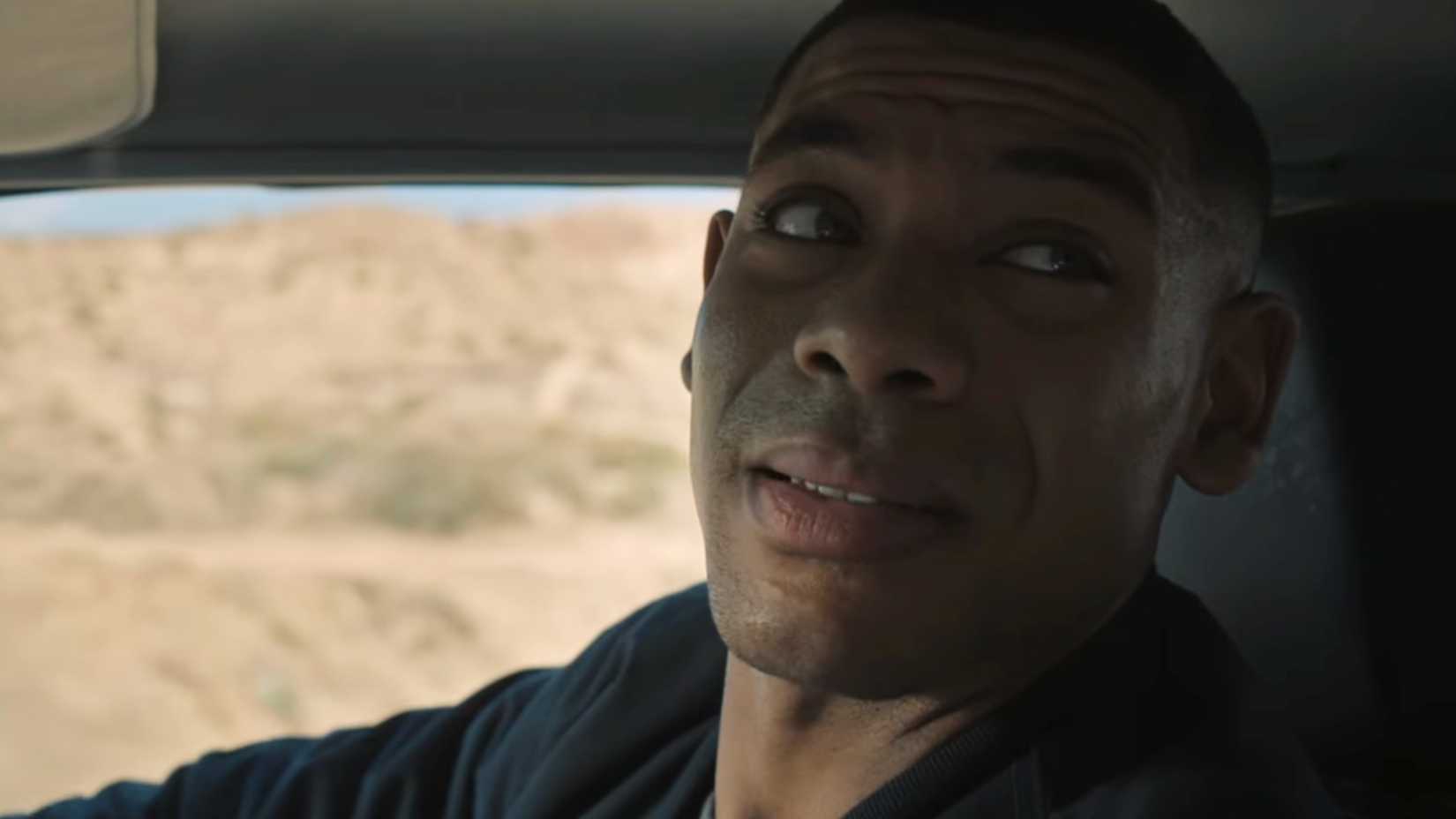 John Stewart In Passenger Seat in Lanterns Trailer