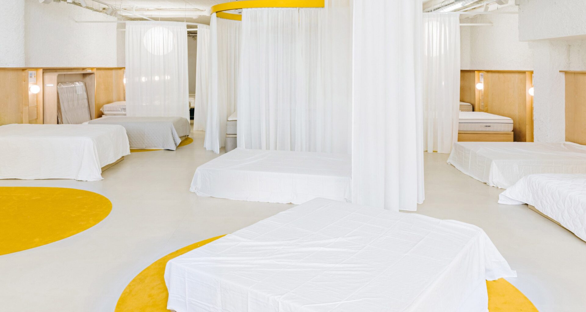 Yellow accents highlight different routes through this mattress store