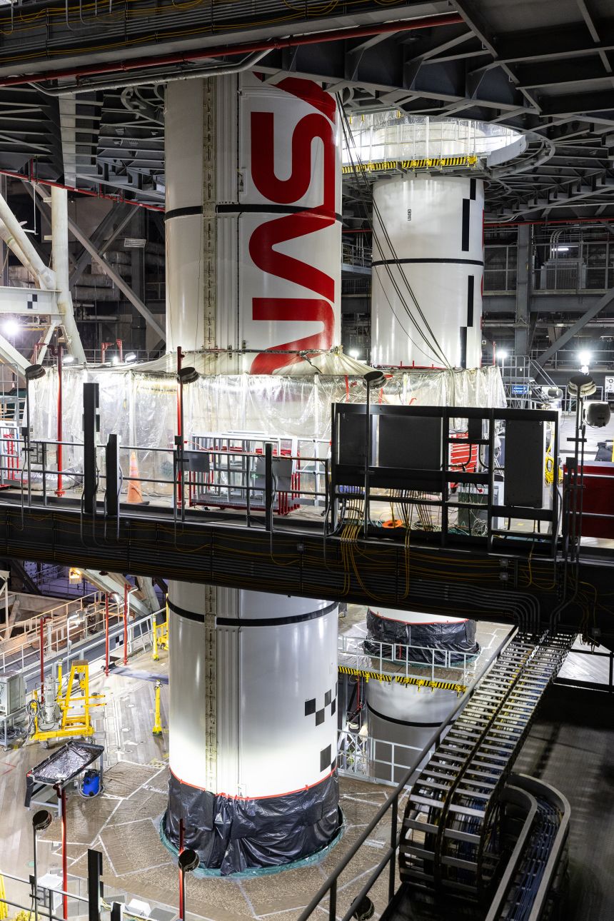 The Artemis II boosters can be seen during the assembly process.