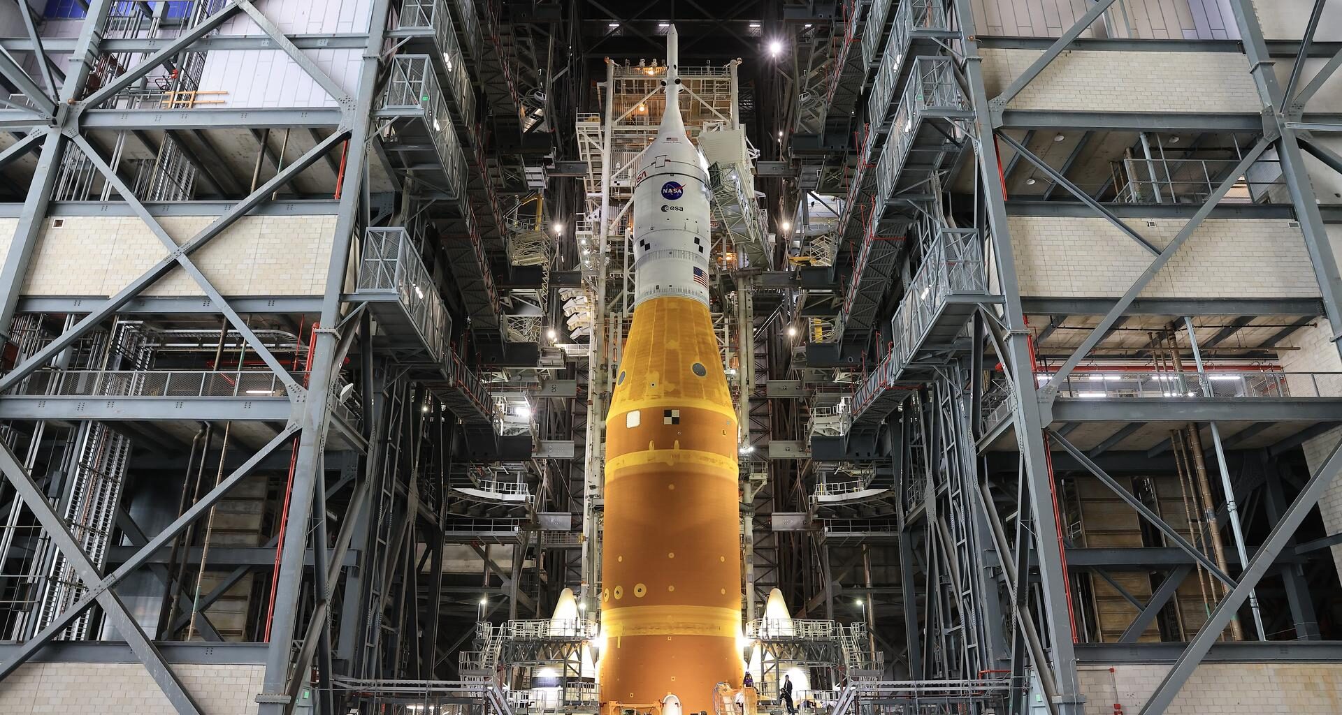 NASA’s Artemis II SLS (Space Launch System) rocket and Orion spacecraft, secured to the mobile launcher, stands vertical inside the Vehicle Assembly building on Tuesday, March 17, 2026, as preparations continue for rollout to Launch Complex 39B at NASA’s Kennedy Space Center in Florida. The Artemis II test flight will take Commander Reid Wiseman, Pilot Victor Glover, and Mission Specialist Christina Koch from NASA, and Mission Specialist Jeremy Hansen from the CSA (Canadian Space Agency), around the Moon and back to Earth with launch opportunities beginning in April 2026.