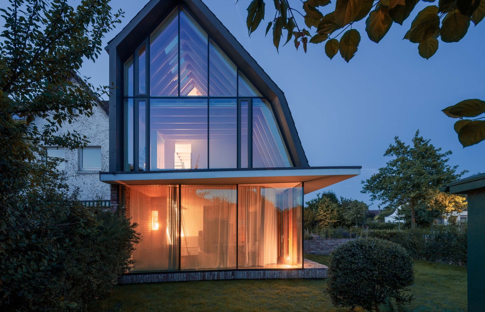 You’d Never Believe This Angular Glass Facade Stands Among Former Military Barracks