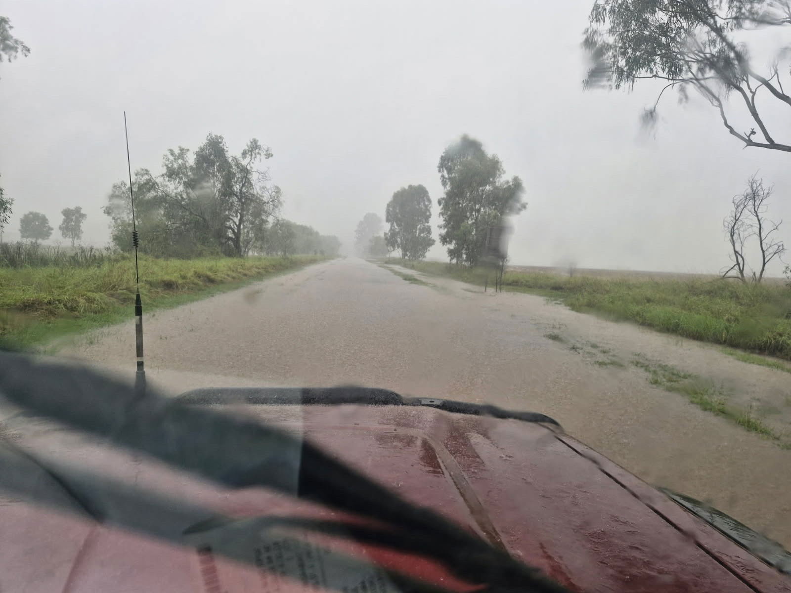 a flooded road seen from a car