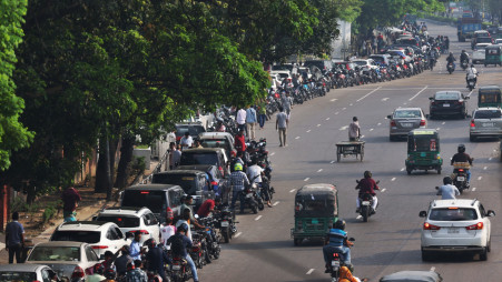 Motorcycles and cars wait in a long queue for fuel on the road in front of the Trust oil pump in Tejgaon. Photo Mehedi Hasan