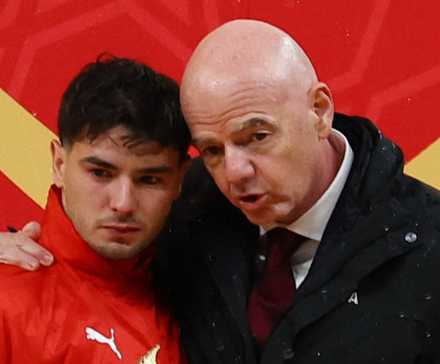 FIFA president Gianni Infantino delivers to Morocco's Brahim Diaz the Golden Boot trophy for AFCON