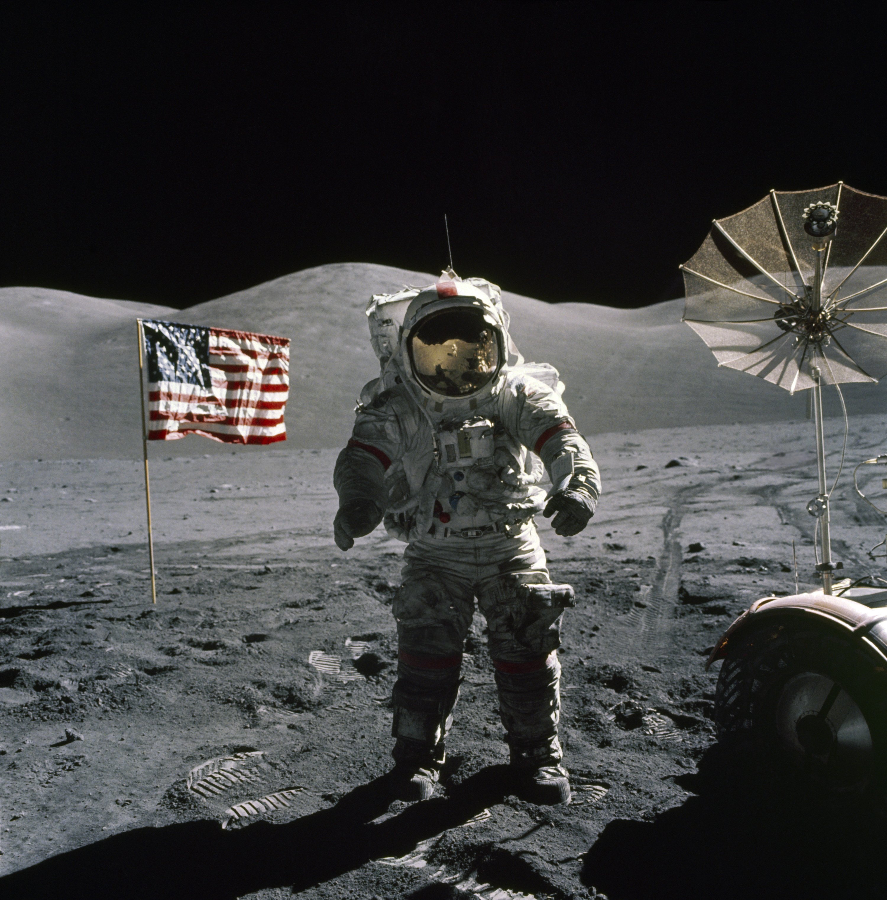 Apollo 17 commander Eugene A. Cernan stands by the American flag on the moon's surface.