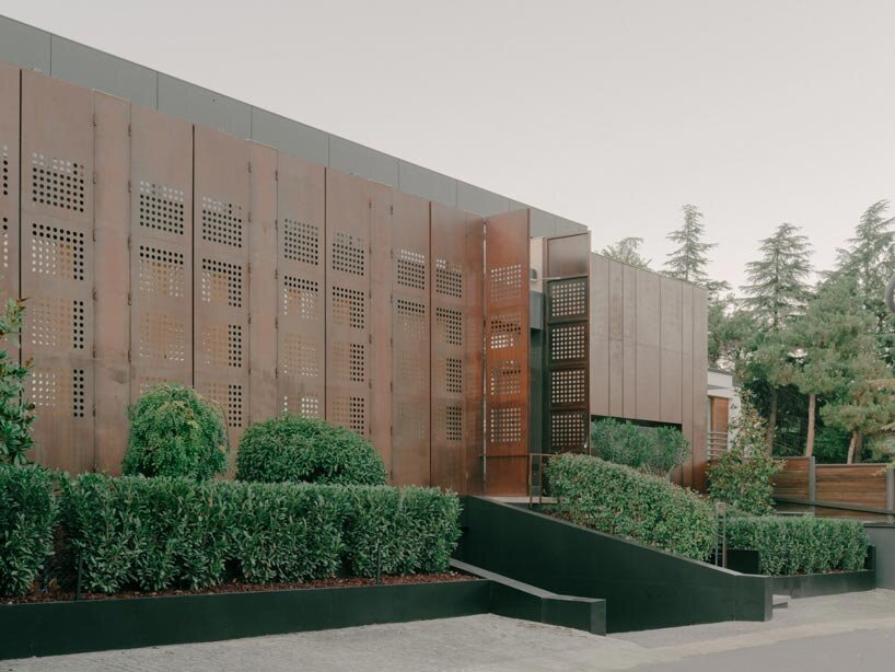 punctured iron doors shape kinetic facade by TIMM architecture in tbilisi - 2