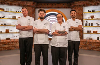 A group of MasterChef professional chefs pose in the MasterChef studio.