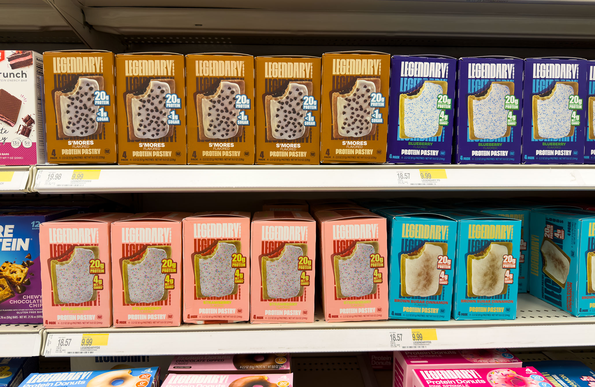 View of a line of protein pastries that look like Pop-Tarts from Legendary in various flavors on a grocery shelf.